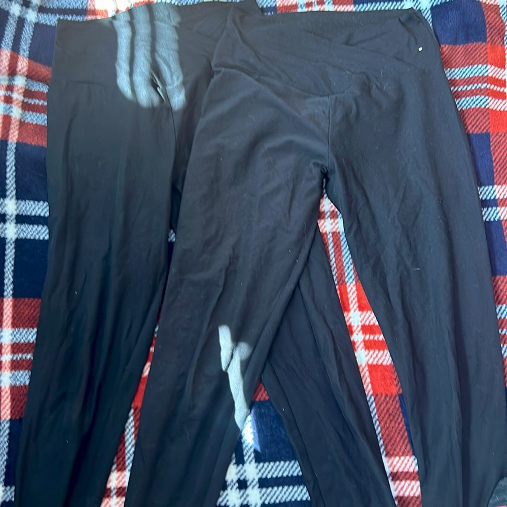 Two pairs of black leggings in a size small